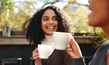 Image Text: 500x332_0030_Two women drinking coffee at a coffee shop