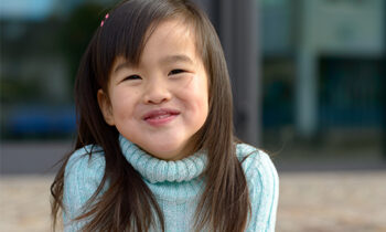 Image Text: 500x332_0059_Friendly little Asian girl with a playful smile